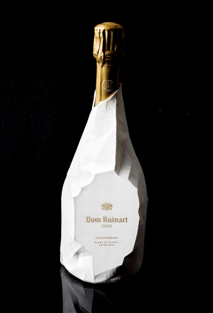 A bottle of Dom Ruinart 2010 in the new moulded fibre packaging.
